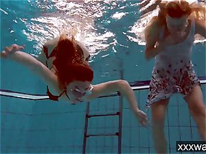 scorching Russian femmes swimming in the pool