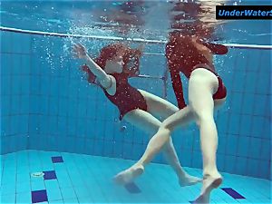 2 steaming teenagers underwater