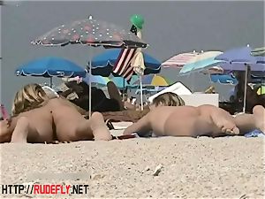 towheaded model naturist on the nude beach spycam video