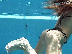 Tiffany Tatum unclothes bare underwater