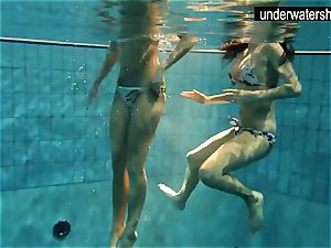 two stunning amateurs flashing their bods off under water